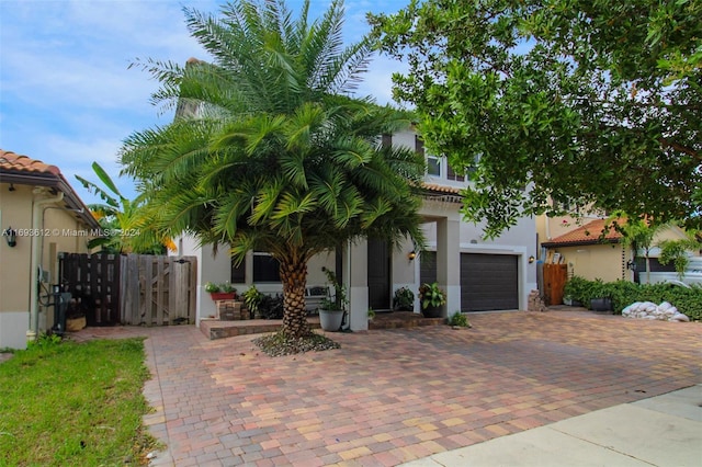 mediterranean / spanish-style home featuring a garage