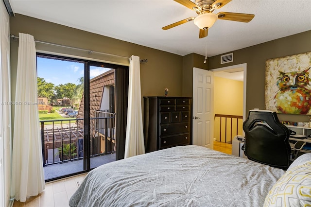 bedroom featuring access to exterior, ceiling fan, and light wood-type flooring