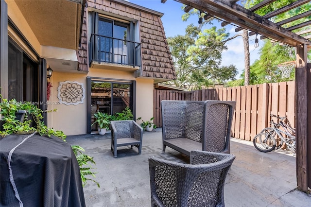 view of patio featuring a pergola and grilling area