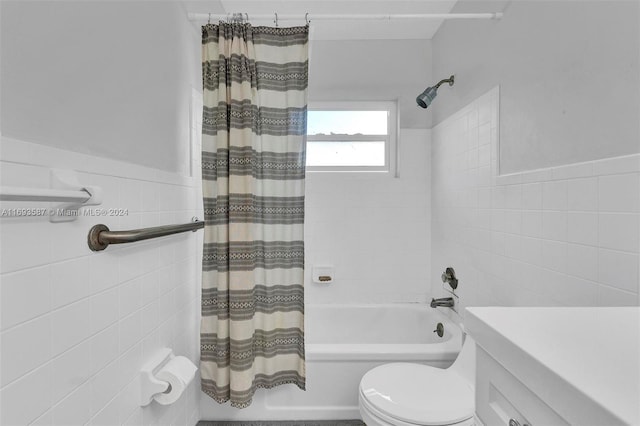 full bathroom featuring vanity, toilet, tile walls, and shower / bath combo with shower curtain