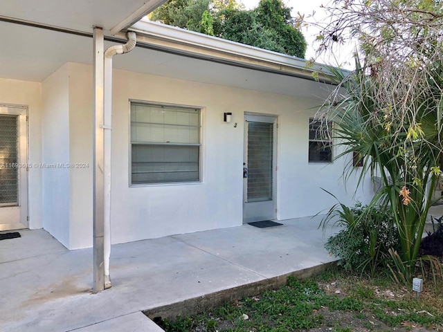 doorway to property with a patio area