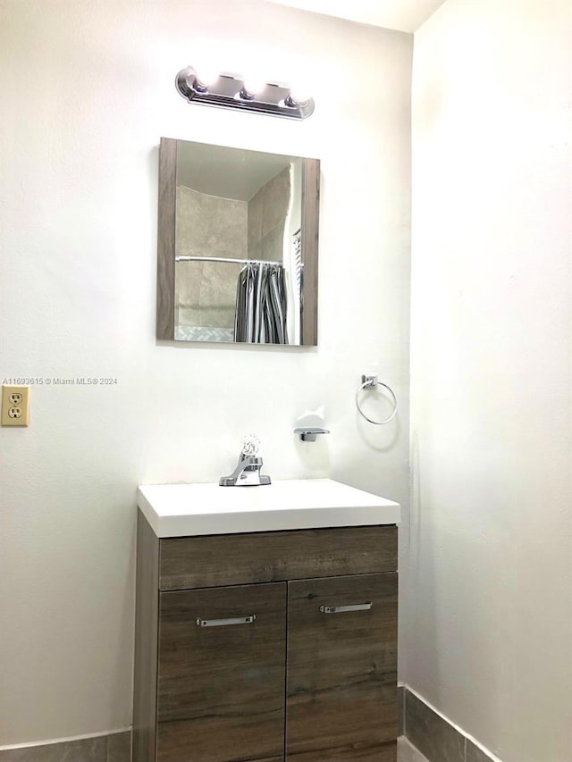 bathroom featuring vanity and walk in shower