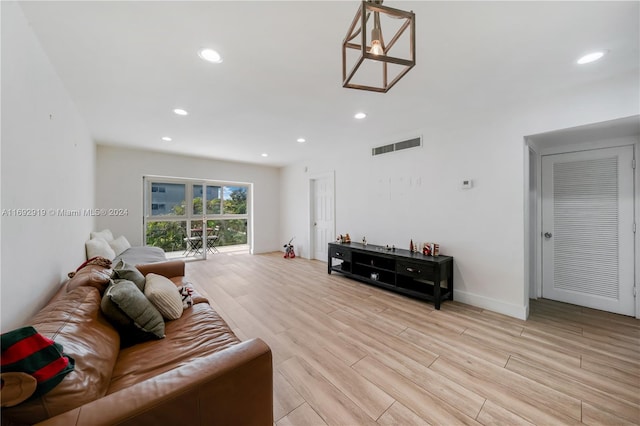 living room with light hardwood / wood-style flooring