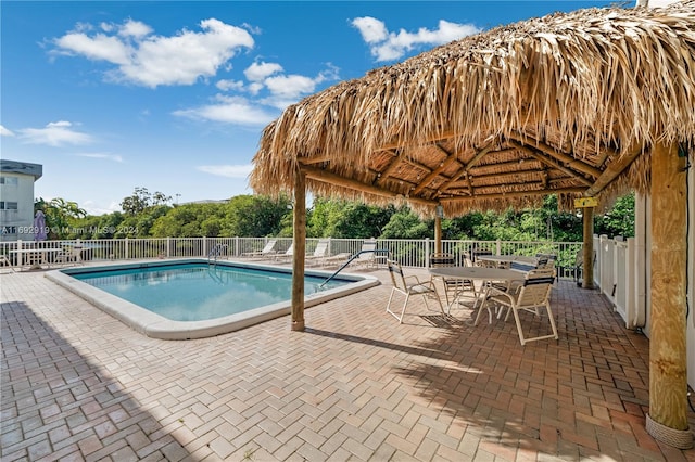 view of swimming pool with a gazebo and a patio area