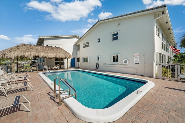 view of swimming pool featuring a patio area