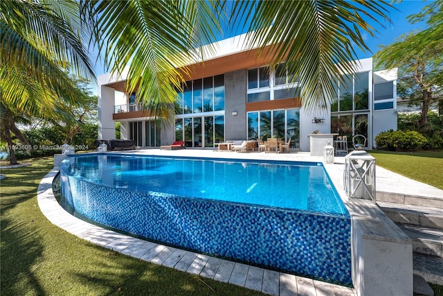 view of swimming pool featuring a patio area