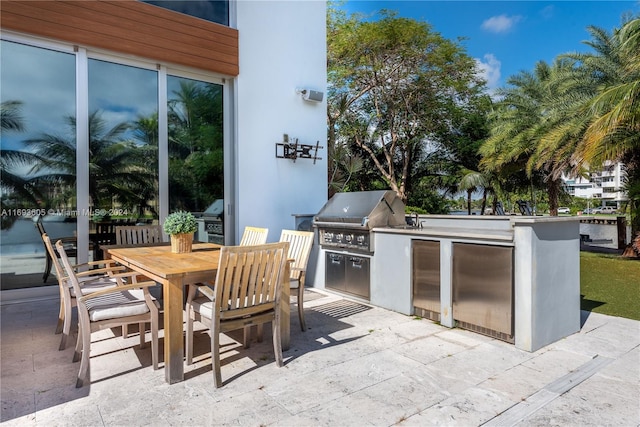 view of patio / terrace with area for grilling and a grill