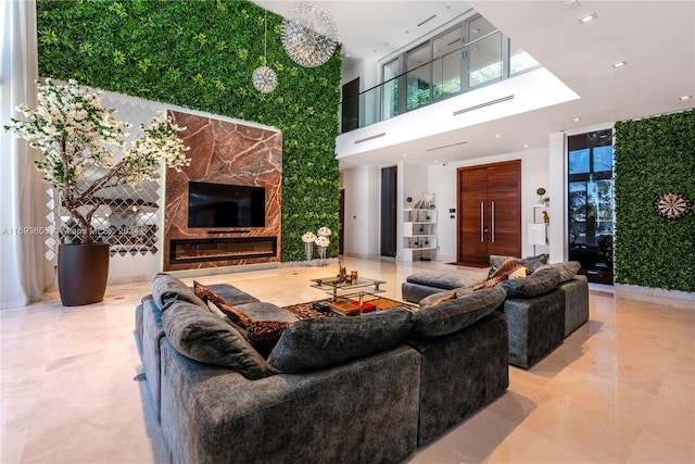 living room featuring a high ceiling