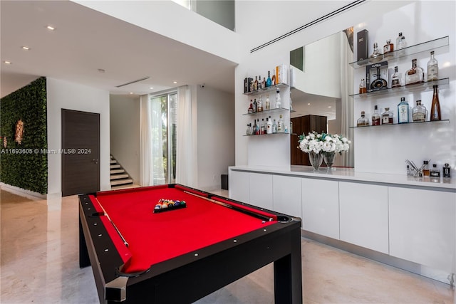 playroom featuring billiards and indoor bar