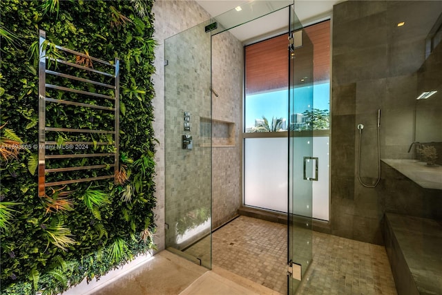 bathroom featuring tile patterned flooring and walk in shower