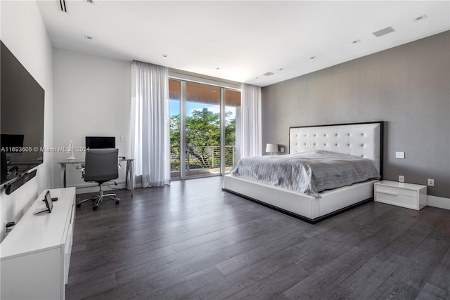 bedroom featuring access to exterior and dark hardwood / wood-style floors