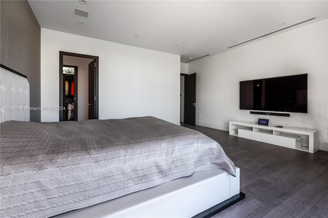 bedroom with dark wood-type flooring