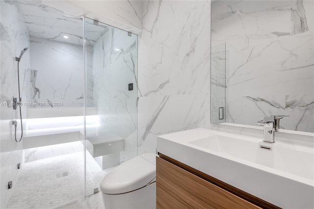 bathroom featuring vanity, an enclosed shower, toilet, and tile walls