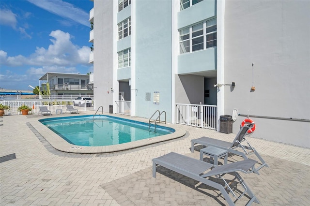 view of pool featuring a patio area