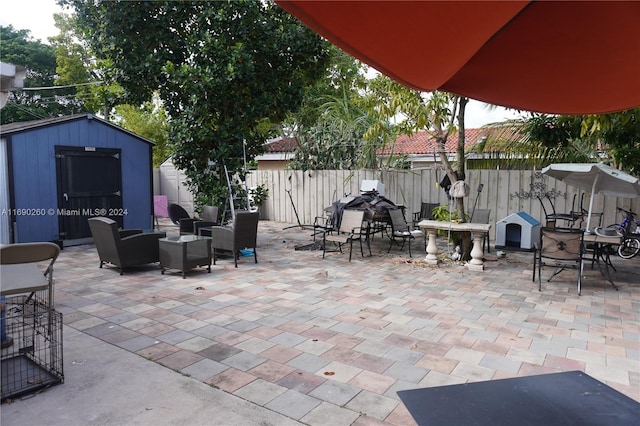 view of patio / terrace featuring a storage unit