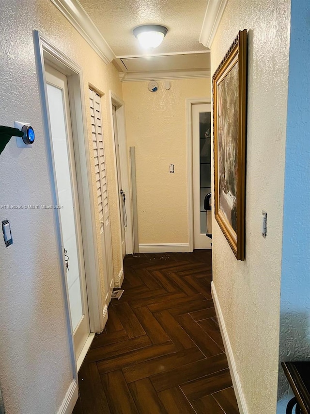 hallway with dark parquet floors and ornamental molding