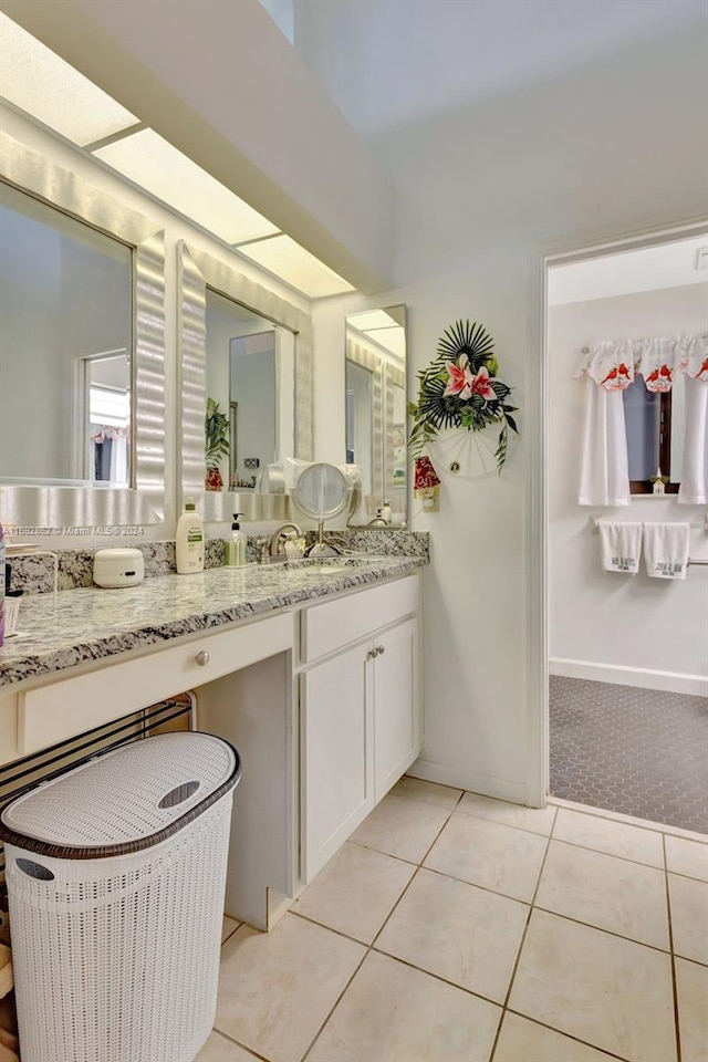 bathroom featuring vanity and tile patterned flooring