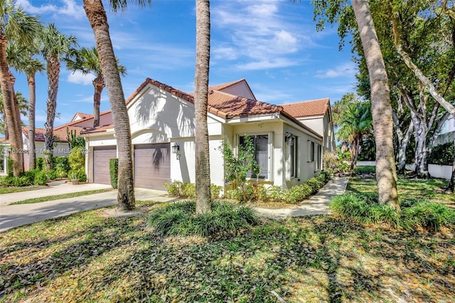 mediterranean / spanish-style home featuring a garage