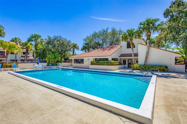 view of swimming pool featuring a patio