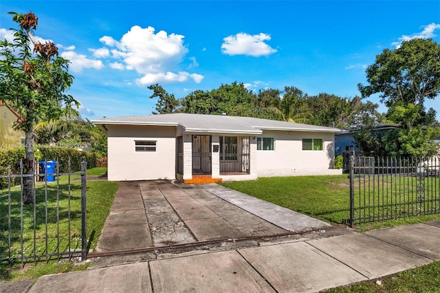 ranch-style home with a front lawn