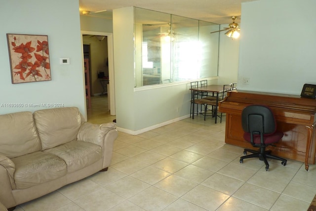 office area with ceiling fan and light tile patterned flooring