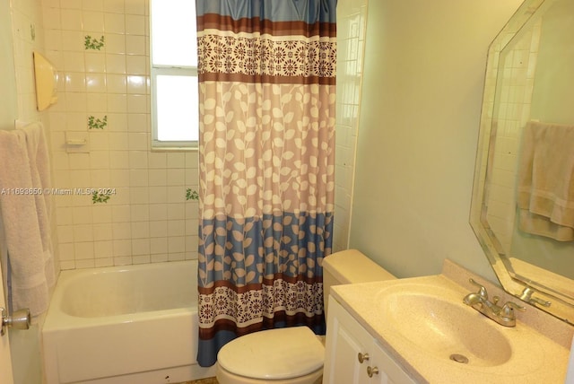 full bathroom with toilet, vanity, and shower / tub combo with curtain