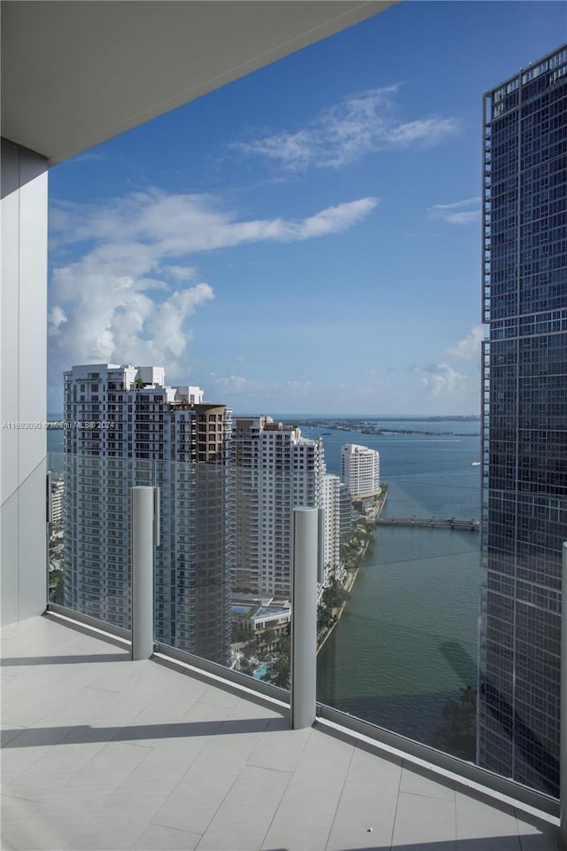 balcony featuring a water view