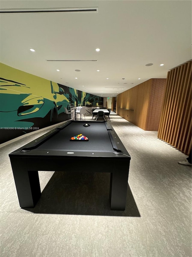 recreation room featuring light carpet, wooden walls, and pool table