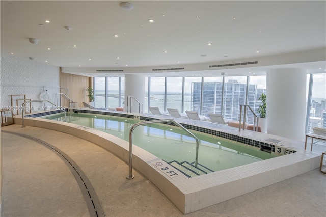 view of pool featuring a jacuzzi