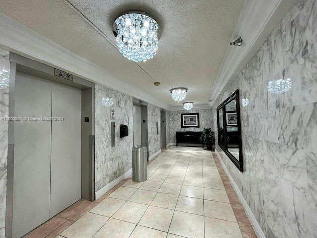 hall featuring elevator, crown molding, a chandelier, and a textured ceiling