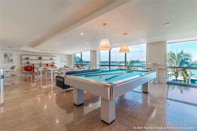 game room featuring floor to ceiling windows and pool table