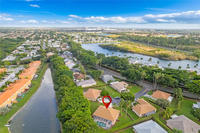 bird's eye view with a water view