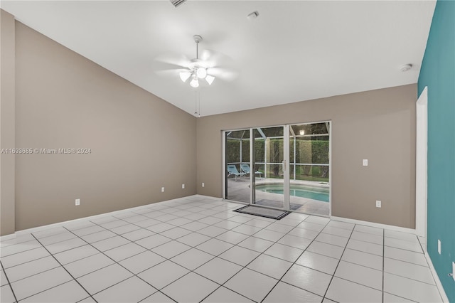 unfurnished room with ceiling fan and light tile patterned flooring