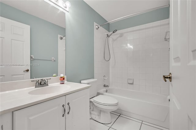 full bathroom with toilet, vanity, tile patterned floors, and tiled shower / bath combo