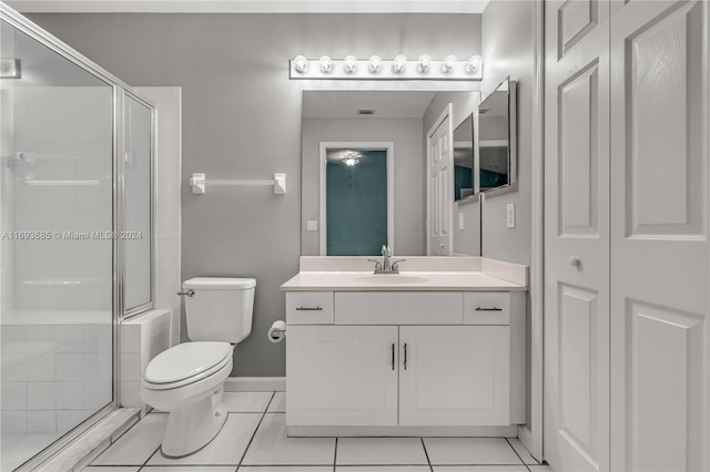 bathroom featuring tile patterned floors, vanity, and toilet