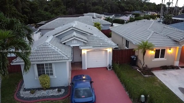 view of front facade with a front yard and a garage