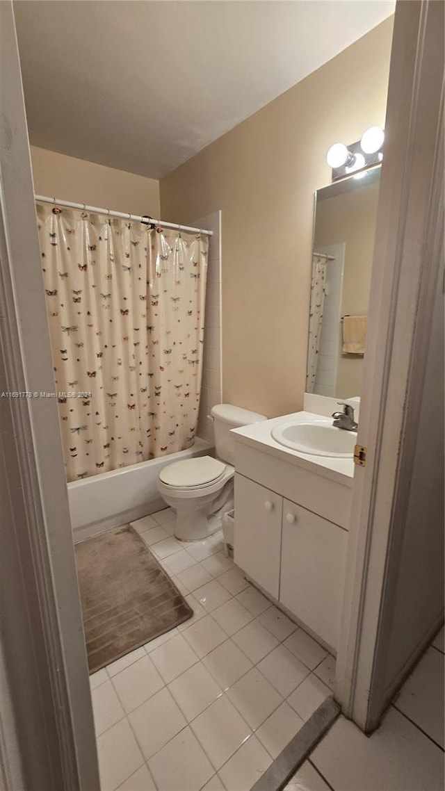 full bathroom with tile patterned flooring, vanity, toilet, and shower / bathtub combination with curtain