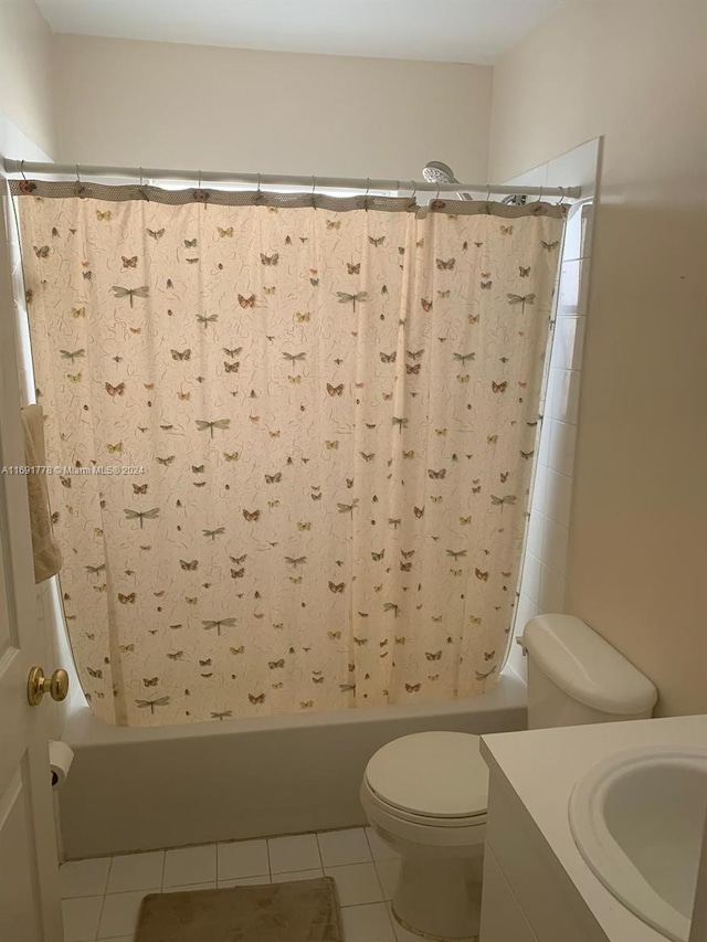 bathroom with tile patterned flooring, vanity, and toilet