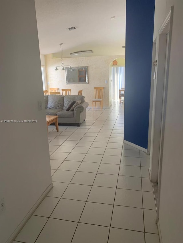 hallway featuring light tile patterned floors