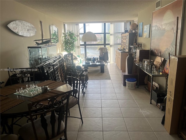 200 Leslie Dr Unit 324, Hallandale Beach, FL 33009 - dining room featuring tile patterned flooring and a textured ceiling