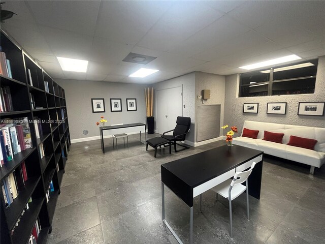 workout area with a paneled ceiling