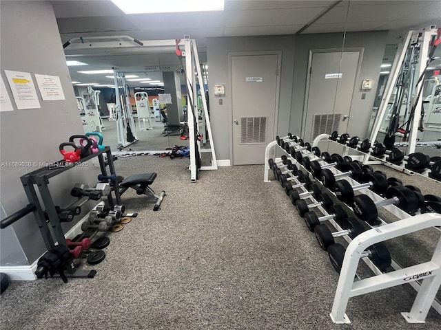 workout area with a drop ceiling