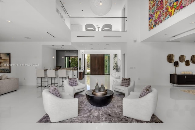 living room featuring a high ceiling