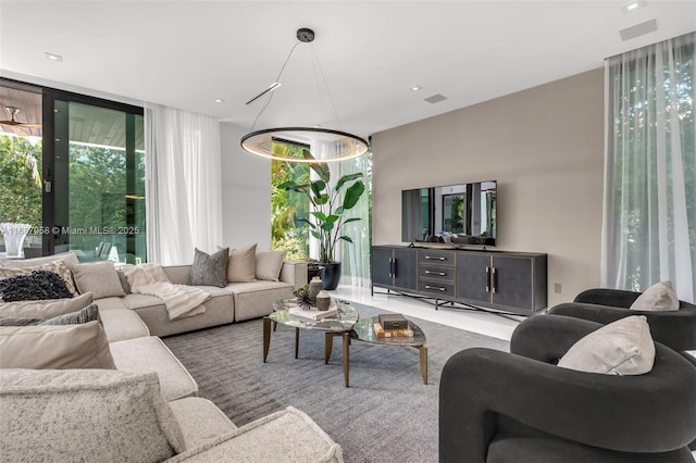 living room with floor to ceiling windows