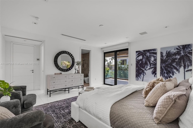 bedroom featuring tile patterned flooring, ensuite bathroom, and access to exterior