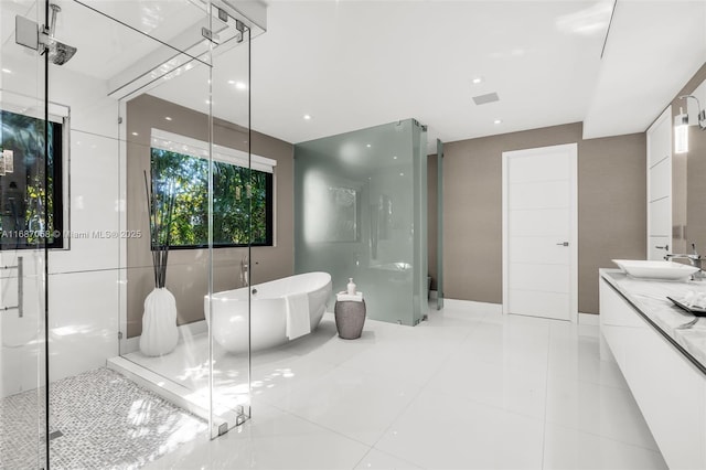 bathroom with vanity, tile patterned flooring, and shower with separate bathtub