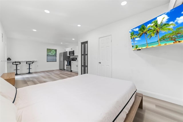 bedroom featuring light wood-type flooring