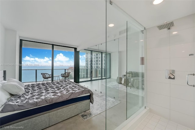 tiled bedroom with access to outside, expansive windows, and a water view