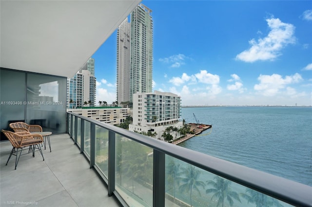 balcony featuring a water view