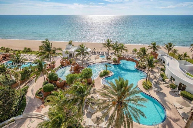 aerial view featuring a water view and a view of the beach